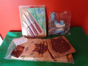 Donation from Kathleen Tucker: a cheese board and knife set, tea towel and owl trivet, map of NL wall ornament and a 25.00 Tim Hortons gift card.