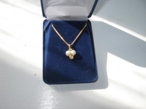 Real gold pendant with pearls and gold chain. Value $320. Made in Switzerland.